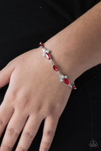 Infused with trios of glassy white rhinestones, glittery red marquise-cut rhinestones link around the wrist for a refined look. Features an adjustable clasp closure.
Sold as one individual bracelet. Infused with trios of glassy white rhinestones, glittery red marquise-cut rhinestones link around the wrist for a refined look. Features an adjustable clasp closure.
Sold as one individual bracelet.