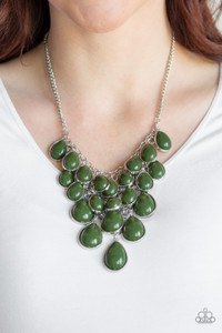 Tinted in the classic rich hue of olive, polished teardrops gradually increase in size as they trickle along rows of interconnected mesh chain. The robust beads drip into a tapered shape, creating a dramatic fringe below the collar. Features an adjustable clasp closure.
Sold as one individual necklace. Includes one pair of matching earrings. Tinted in the classic rich hue of olive, polished teardrops gradually increase in size as they trickle along rows of interconnected mesh chain. The robust beads drip into a tapered shape, creating a dramatic fringe below the collar. Features an adjustable clasp closure.
Sold as one individual necklace. Includes one pair of matching earrings.