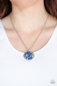 Infused with metallic and glassy white rhinestone prisms, bits of blue rock and dainty silver beads are sprinkled along the center of a round silver frame, creating a glittering pendant below the collar. Features an adjustable clasp closure.
Sold as one individual necklace. Includes one pair of matching earrings. Infused with metallic and glassy white rhinestone prisms, bits of blue rock and dainty silver beads are sprinkled along the center of a round silver frame, creating a glittering pendant below the collar. Features an adjustable clasp closure.
Sold as one individual necklace. Includes one pair of matching earrings.