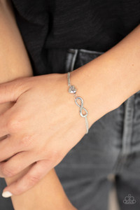 A glistening silver infinity and silver heart stamped in the word, "Mom", delicately link across the wrist for a timeless look. Features an adjustable clasp closure.
Sold as one individual bracelet. A glistening silver infinity and silver heart stamped in the word, "Mom", delicately link across the wrist for a timeless look. Features an adjustable clasp closure.
Sold as one individual bracelet.