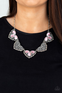 Filled with lacy-like patterns, filigree filled silver frames connect below the collar. Glowing pink, white, green, or purple teardrop moonstones alternate along the airy frames, adding a refreshing hint of color to the whimsical fringe. Features an adjustable clasp closure.

Sold as one individual necklace. Includes one pair of matching earrings.