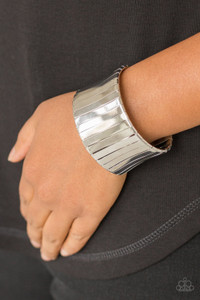 Flat silver frames wrap around a silver frame, creating a bold cuff around the wrist.
Sold as one individual bracelet. Flat silver frames wrap around a silver frame, creating a bold cuff around the wrist.
Sold as one individual bracelet.