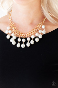 A collection of classic and imperfect white pearls dangle from a web of interlocking gold links below the collar, adding a modern twist to the timeless palette. Features an adjustable clasp closure.
Sold as one individual necklace. Includes one pair of matching earrings. A collection of classic and imperfect white pearls dangle from a web of interlocking gold links below the collar, adding a modern twist to the timeless palette. Features an adjustable clasp closure.
Sold as one individual necklace. Includes one pair of matching earrings.