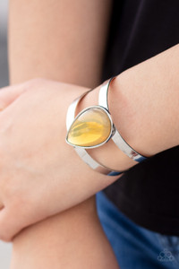 Featuring a sleek silver frame, an opalescent yellow teardrop bead sits atop an airy silver cuff in an ethereal fashion.
Sold as one individual bracelet. Featuring a sleek silver frame, an opalescent yellow teardrop bead sits atop an airy silver cuff in an ethereal fashion.
Sold as one individual bracelet.