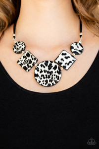 Featuring textured white and gray cheetah print, a wild collection of circle and square leather pieces are threaded along an invisible wire below the collar for a fierce look. Features an adjustable clasp closure.
Sold as one individual necklace. Includes one pair of matching earrings. Featuring textured white and gray cheetah print, a wild collection of circle and square leather pieces are threaded along an invisible wire below the collar for a fierce look. Features an adjustable clasp closure.
Sold as one individual necklace. Includes one pair of matching earrings.