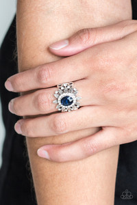 Ringed in glittery white rhinestones, a glittery blue gem is pressed into the center of a leafy silver frame. Dainty white rhinestones are sprinkled along the shimmery foliage for a refined finish. Features a stretchy band for a flexible fit.
Sold as one individual ring. Ringed in glittery white rhinestones, a glittery blue gem is pressed into the center of a leafy silver frame. Dainty white rhinestones are sprinkled along the shimmery foliage for a refined finish. Features a stretchy band for a flexible fit.
Sold as one individual ring.