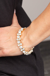 Featuring sleek gold frames, trios of glittery white rhinestones are threaded along stretchy bands around the wrist for a timeless shimmer.
Sold as one individual bracelet. Featuring sleek gold frames, trios of glittery white rhinestones are threaded along stretchy bands around the wrist for a timeless shimmer.
Sold as one individual bracelet.