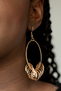 A collection of dainty gold rings are secured in place along the bottom of a gold oval frame, creating a dizzying fringe. Earring attaches to a standard fishhook fitting.
Sold as one pair of earrings. A collection of dainty gold rings are secured in place along the bottom of a gold oval frame, creating a dizzying fringe. Earring attaches to a standard fishhook fitting.
Sold as one pair of earrings.