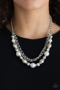Layers of mismatched silver chains give way to a strand of ornate silver beads and oversized white pearls that cascade below the collar for a refined flair. Features an adjustable clasp closure.
Sold as one individual necklace. Includes one pair of matching earrings. Layers of mismatched silver chains give way to a strand of ornate silver beads and oversized white pearls that cascade below the collar for a refined flair. Features an adjustable clasp closure.
Sold as one individual necklace. Includes one pair of matching earrings.