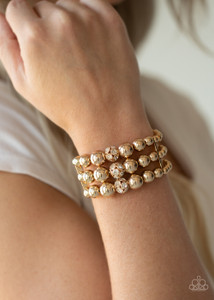 Held together with dainty gold fittings, strands of gold beads are threaded along stretchy bands around the wrist. Glassy white rhinestone encrusted beads adorn the center, adding a splash of sparkle to the gorgeously layered look.
Sold as one individual bracelet. Held together with dainty gold fittings, strands of gold beads are threaded along stretchy bands around the wrist. Glassy white rhinestone encrusted beads adorn the center, adding a splash of sparkle to the gorgeously layered look.
Sold as one individual bracelet.