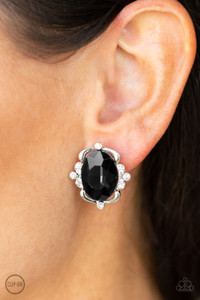Sporadically dotted in sections of glassy white rhinestones, shimmery ribbons of silver gently fold around a dazzling black emerald-style gem center for a regal look. Earring attaches to a standard clip-on fitting.
Sold as one pair of clip-on earrings. Sporadically dotted in sections of glassy white rhinestones, shimmery ribbons of silver gently fold around a dazzling black emerald-style gem center for a regal look. Earring attaches to a standard clip-on fitting.
Sold as one pair of clip-on earrings.