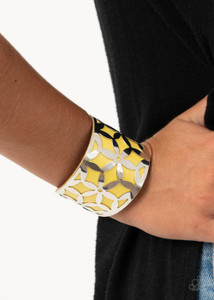 A thick piece of yellow leather peeks out through a daisy stenciled silver cuff, creating a colorful centerpiece around the wrist.
Sold as one individual bracelet. A thick piece of yellow leather peeks out through a daisy stenciled silver cuff, creating a colorful centerpiece around the wrist.
Sold as one individual bracelet.