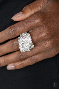 Encrusted in row after row of glassy white rhinestones, warped silver bands coalesce into a single sparkling frame across the finger for an edgy look. Features a stretchy band for a flexible fit.
Sold as one individual ring. Encrusted in row after row of glassy white rhinestones, warped silver bands coalesce into a single sparkling frame across the finger for an edgy look. Features a stretchy band for a flexible fit.
Sold as one individual ring.