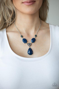 A collection of blue and white rhinestone dotted silver frames link with a pair of blue oval gems below the collar. A dramatically oversized blue teardrop drips from the center, creating a glamorous pendant. Features an adjustable clasp closure.
Sold as one individual necklace. Includes one pair of matching earrings. A collection of blue and white rhinestone dotted silver frames link with a pair of blue oval gems below the collar. A dramatically oversized blue teardrop drips from the center, creating a glamorous pendant. Features an adjustable clasp closure.
Sold as one individual necklace. Includes one pair of matching earrings.