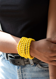 Held in place with rectangular wooden fittings, a collection of sunny yellow wooden beads are threaded along stretchy bands around the wrist, creating colorful layers.
Sold as one individual bracelet. Held in place with rectangular wooden fittings, a collection of sunny yellow wooden beads are threaded along stretchy bands around the wrist, creating colorful layers.
Sold as one individual bracelet.
