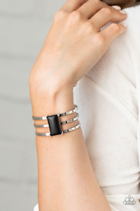 Chiseled into a sleek rectangle, a smooth black stone is pressed into the center of a silver layered cuff for a seasonal flair.
Sold as one individual bracelet. Chiseled into a sleek rectangle, a smooth black stone is pressed into the center of a silver layered cuff for a seasonal flair.
Sold as one individual bracelet.