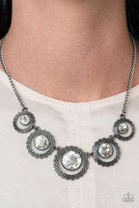 Graduating in size, a series of glittery white rhinestones are asymmetrical nestled inside glistening gunmetal frames featuring box chain-like texture. The edgy display delicately links below the collar, creating an unexpected hint of sparkle. Features an adjustable clasp closure.
Sold as one individual necklace. Includes one pair of matching earrings. Graduating in size, a series of glittery white rhinestones are asymmetrical nestled inside glistening gunmetal frames featuring box chain-like texture. The edgy display delicately links below the collar, creating an unexpected hint of sparkle. Features an adjustable clasp closure.
Sold as one individual necklace. Includes one pair of matching earrings.