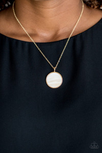 A flat shell-like pendant swings from the bottom of a dainty gold chain below the collar for a refined look. Features an adjustable clasp closure.
Sold as one individual necklace. Includes one pair of matching earrings. A flat shell-like pendant swings from the bottom of a dainty gold chain below the collar for a refined look. Features an adjustable clasp closure.
Sold as one individual necklace. Includes one pair of matching earrings.