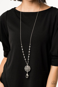 A collection of glassy white and opaque white beads trickle down the bottom of a lengthened silver chain. Dotted with dainty white and opalescent rhinestones, a floral medallion-like pendant swings from the bottom for a whimsical finish. Features an adjustable clasp closure.
Sold as one individual necklace. Includes one pair of matching earrings. A collection of glassy white and opaque white beads trickle down the bottom of a lengthened silver chain. Dotted with dainty white and opalescent rhinestones, a floral medallion-like pendant swings from the bottom for a whimsical finish. Features an adjustable clasp closure.
Sold as one individual necklace. Includes one pair of matching earrings.