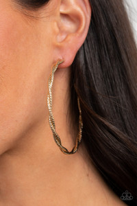 Featuring diamond-cut shimmer, two glistening gold wires delicately twist into an oversized hoop for an edgy look. Earring attaches to a standard post fitting. Hoop measures approximately 2 3/4" in diameter.
Sold as one pair of hoop earrings. Featuring diamond-cut shimmer, two glistening gold wires delicately twist into an oversized hoop for an edgy look. Earring attaches to a standard post fitting. Hoop measures approximately 2 3/4" in diameter.
Sold as one pair of hoop earrings.