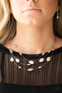 Featuring smooth and delicately hammered finishes, mismatched shiny copper, gold, and silver beads are threaded along dainty silver wire, creating floating layers below the collar. Features an adjustable clasp closure.
Sold as one individual necklace. Includes one pair of matching earrings. Featuring smooth and delicately hammered finishes, mismatched shiny copper, gold, and silver beads are threaded along dainty silver wire, creating floating layers below the collar. Features an adjustable clasp closure.
Sold as one individual necklace. Includes one pair of matching earrings.