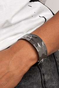 A shimmery gunmetal cuff hammered in texture wraps around the wrist for a bold pop of industrial inspiration.
Sold as one individual bracelet. A shimmery gunmetal cuff hammered in texture wraps around the wrist for a bold pop of industrial inspiration.
Sold as one individual bracelet.