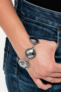 Featuring dramatically studded silver frames, an exaggerated display of oversized hematite rhinestone encrusted frames delicately link around the wrist for a blinding look. Features an adjustable clasp closure.
Sold as one individual bracelet. Featuring dramatically studded silver frames, an exaggerated display of oversized hematite rhinestone encrusted frames delicately link around the wrist for a blinding look. Features an adjustable clasp closure.
Sold as one individual bracelet.