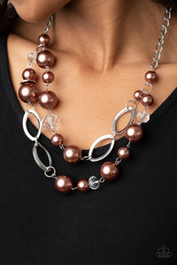 A glamorous collection of white crystal-like beads, shiny silver ovals, and oversized brown pearls delicately connect into two bubbly layers below the collar for an effortless glow. Features an adjustable clasp closure.
Sold as one individual necklace. Includes one pair of matching earrings. A glamorous collection of white crystal-like beads, shiny silver ovals, and oversized brown pearls delicately connect into two bubbly layers below the collar for an effortless glow. Features an adjustable clasp closure.
Sold as one individual necklace. Includes one pair of matching earrings.
