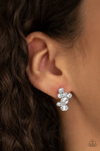 Encased in sleek silver fittings, a collision of glassy white rhinestones coalesces into a glittery frame. Earring attaches to a standard post fitting.
Sold as one pair of post earrings. Encased in sleek silver fittings, a collision of glassy white rhinestones coalesces into a glittery frame. Earring attaches to a standard post fitting.
Sold as one pair of post earrings.