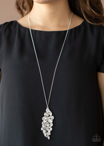 Featuring round, oval, square, teardrop, and marquise style cuts, a glittery collection of white rhinestones fan out from a shiny silver bar, creating a sparkly leaf pendant at the bottom of a lengthened silver chain. Features an adjustable clasp closure.
Sold as one individual necklace. Includes one pair of matching earrings. Featuring round, oval, square, teardrop, and marquise style cuts, a glittery collection of white rhinestones fan out from a shiny silver bar, creating a sparkly leaf pendant at the bottom of a lengthened silver chain. Features an adjustable clasp closure.
Sold as one individual necklace. Includes one pair of matching earrings.