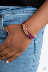 Infused with sections of shimmery silver cubes, a colorful collision of Magenta Purple and brown beads are threaded along a coiled wire, creating an earthy infinity wrap style bracelet around the wrist.
Sold as one individual bracelet. Infused with sections of shimmery silver cubes, a colorful collision of Magenta Purple and brown beads are threaded along a coiled wire, creating an earthy infinity wrap style bracelet around the wrist.
Sold as one individual bracelet.