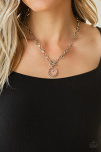 A pink rhinestone encrusted silver heart is nestled inside a shiny silver hoop, creating a charming pendant at the bottom of an exaggerated silver chain. Features a toggle closure.
Sold as one individual necklace. Includes one pair of matching earrings. A pink rhinestone encrusted silver heart is nestled inside a shiny silver hoop, creating a charming pendant at the bottom of an exaggerated silver chain. Features a toggle closure.
Sold as one individual necklace. Includes one pair of matching earrings.