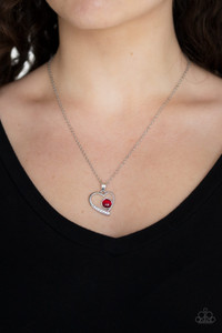 A dainty pink or red cat's eye stone is nestled inside of a silver heart frame. The bottom of the pendant is encrusted in a section of glassy white rhinestones, creating a romantic pendant below the collar. Features an adjustable clasp closure.
Sold as one individual necklace. Includes one pair of matching earrings. A dainty pink or red cat's eye stone is nestled inside of a silver heart frame. The bottom of the pendant is encrusted in a section of glassy white rhinestones, creating a romantic pendant below the collar. Features an adjustable clasp closure.
Sold as one individual necklace. Includes one pair of matching earrings.