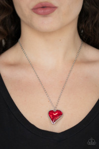Chiseled into a charming heart, an oversized red rhinestone gem is nestled inside a sleek silver frame, creating a flirtatious pendant below the collar. Features an adjustable clasp closure.
Sold as one individual necklace. Includes one pair of matching earrings. Chiseled into a charming heart, an oversized red rhinestone gem is nestled inside a sleek silver frame, creating a flirtatious pendant below the collar. Features an adjustable clasp closure.
Sold as one individual necklace. Includes one pair of matching earrings.