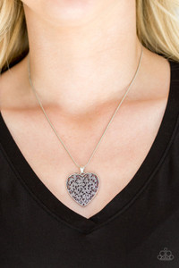 Filled with vine-like filigree detail, a silver heart pendant swings below the collar for a vintage inspired look. Features an adjustable clasp closure.
Sold as one individual necklace. Includes one pair of matching earrings. Filled with vine-like filigree detail, a silver heart pendant swings below the collar for a vintage inspired look. Features an adjustable clasp closure.
Sold as one individual necklace. Includes one pair of matching earrings.