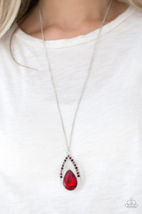 A fiery red teardrop gem is pressed into a silver frame radiating with black, hematite, and red rhinestones. The glamorous pendant swings from the bottom of a shimmery silver chain for a refined look. Features an adjustable clasp closure.

Sold as one individual necklace. Includes one pair of matching earrings.