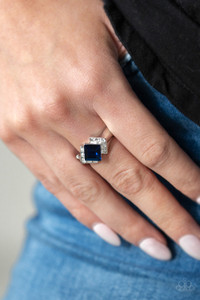Featuring a regal square cut, a glittery blue rhinestone sits atop a bold silver band dusted in sparkling white rhinestones for a refined flair. Features a dainty stretchy band for a flexible fit.
Sold as one individual ring. Featuring a regal square cut, a glittery blue rhinestone sits atop a bold silver band dusted in sparkling white rhinestones for a refined flair. Features a dainty stretchy band for a flexible fit.
Sold as one individual ring.