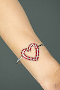 Two rows of glittery red rhinestones stack into a sparkling heart atop a dainty silver cuff for a charming look.
Sold as one individual bracelet. Two rows of glittery red rhinestones stack into a sparkling heart atop a dainty silver cuff for a charming look.
Sold as one individual bracelet.