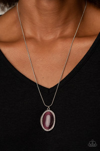 Encrusted with a ring of glittery white rhinestones, a wavy silver frame nestles around a glassy purple cat's eye stone. The dewy frame slides along a rounded silver snake chain, creating a glistening pendant below the collar. Features an adjustable clasp closure.
Sold as one individual necklace. Includes one pair of matching earrings. Encrusted with a ring of glittery white rhinestones, a wavy silver frame nestles around a glassy purple cat's eye stone. The dewy frame slides along a rounded silver snake chain, creating a glistening pendant below the collar. Features an adjustable clasp closure.
Sold as one individual necklace. Includes one pair of matching earrings.