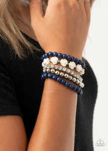 A vintage inspired collection of white resin roses, navy beads, and classic silver beads join a stretchy band of glittery white rhinestones dotted around the wrist for a flawlessly stacked look.
Sold as one set of five bracelets. A vintage inspired collection of white resin roses, navy beads, and classic silver beads join a stretchy band of glittery white rhinestones dotted around the wrist for a flawlessly stacked look.
Sold as one set of five bracelets.