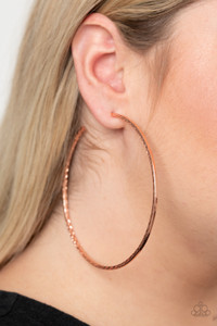 Etched in a diamond cut textures, a dramatically oversized shiny copper hoop curls around the ear for an exaggerated look. Earring attaches to a standard post fitting. Hoop measures approximately 3 1/2" in diameter.
Sold as one pair of hoop earrings. Etched in a diamond cut textures, a dramatically oversized shiny copper hoop curls around the ear for an exaggerated look. Earring attaches to a standard post fitting. Hoop measures approximately 3 1/2" in diameter.
Sold as one pair of hoop earrings.