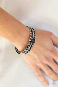 Dotted with a black stone teardrop center, rows of dainty black stones flank a thick silver bar that arcs across the wrist for an authentic look. Features a side hinged closure.
Sold as one individual bracelet. Dotted with a black stone teardrop center, rows of dainty black stones flank a thick silver bar that arcs across the wrist for an authentic look. Features a side hinged closure.
Sold as one individual bracelet.