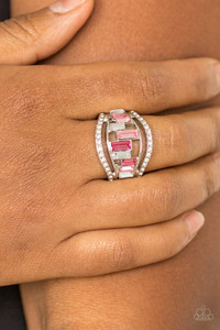 White rhinestone encrusted bands flank a row of emerald cut glass beads in shades of pink and white for a regal look. Features a stretchy band for a flexible fit. White rhinestone encrusted bands flank a row of emerald cut glass beads in shades of pink and white for a regal look. Features a stretchy band for a flexible fit.