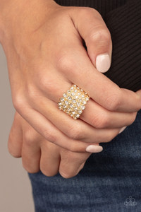 Row after row of blinding white rhinestones are stacked across a thick gold band for a dramatic look. Features a stretchy band for a flexible fit.
Sold as one individual ring. Row after row of blinding white rhinestones are stacked across a thick gold band for a dramatic look. Features a stretchy band for a flexible fit.
Sold as one individual ring.