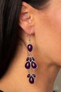 Encased in sleek silver fittings, a glassy collection of marquise and teardrop blue or purple beads delicately connect into a dramatically colorful lure. Earring attaches to a standard fishhook fitting.
Sold as one pair of earrings. Encased in sleek silver fittings, a glassy collection of marquise and teardrop blue or purple beads delicately connect into a dramatically colorful lure. Earring attaches to a standard fishhook fitting.
Sold as one pair of earrings.