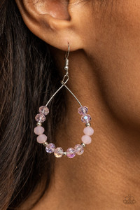 Infused with dainty silver beads, a sparkly collection of glassy and opalescent pink crystal-like beads glide along a dainty silver wire, coalescing into a twinkly teardrop. Earring attaches to a standard fishhook fitting.

Sold as one pair of earrings.