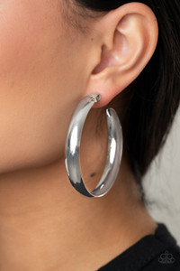 A thick silver bar dramatically curls into an oversized hoop for a classic look. Earring attaches to a standard post fitting. Hoop measures approximately 2 1/2" in diameter.
Sold as one pair of hoop earrings. A thick silver bar dramatically curls into an oversized hoop for a classic look. Earring attaches to a standard post fitting. Hoop measures approximately 2 1/2" in diameter.
Sold as one pair of hoop earrings.