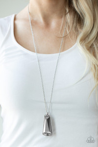 A faceted hematite gem is pressed into the center of a flared silver frame dotted in sections of dainty hematite rhinestones. The glittery frame swings from the bottom of a lengthened silver chain, creating an edgy pendant. Features an adjustable clasp closure.
Sold as one individual necklace. Includes one pair of matching earrings. A faceted hematite gem is pressed into the center of a flared silver frame dotted in sections of dainty hematite rhinestones. The glittery frame swings from the bottom of a lengthened silver chain, creating an edgy pendant. Features an adjustable clasp closure.
Sold as one individual necklace. Includes one pair of matching earrings.