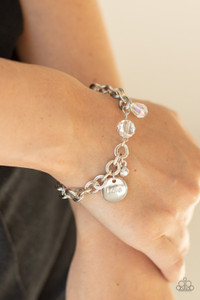 Iridescent crystal-like beads, a dainty white rhinestone, and a silver disc stamped in the word, "love," adorn a double-linked silver chain, creating a flirty fringe around the wrist. Features an adjustable clasp closure.
Sold as one individual bracelet. Iridescent crystal-like beads, a dainty white rhinestone, and a silver disc stamped in the word, "love," adorn a double-linked silver chain, creating a flirty fringe around the wrist. Features an adjustable clasp closure.
Sold as one individual bracelet.