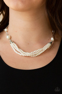 Oversized white pearls and crystal-like beads give way to layers of beaded pearl strands below the collar for a timeless look. Features an adjustable clasp closure.

Sold as one individual necklace. Includes one pair of matching earrings.